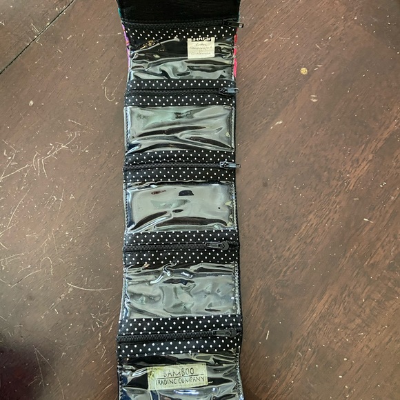 Bamboo Trading Company fold up case with 5 individual zippered compartments. - Picture 3 of 3